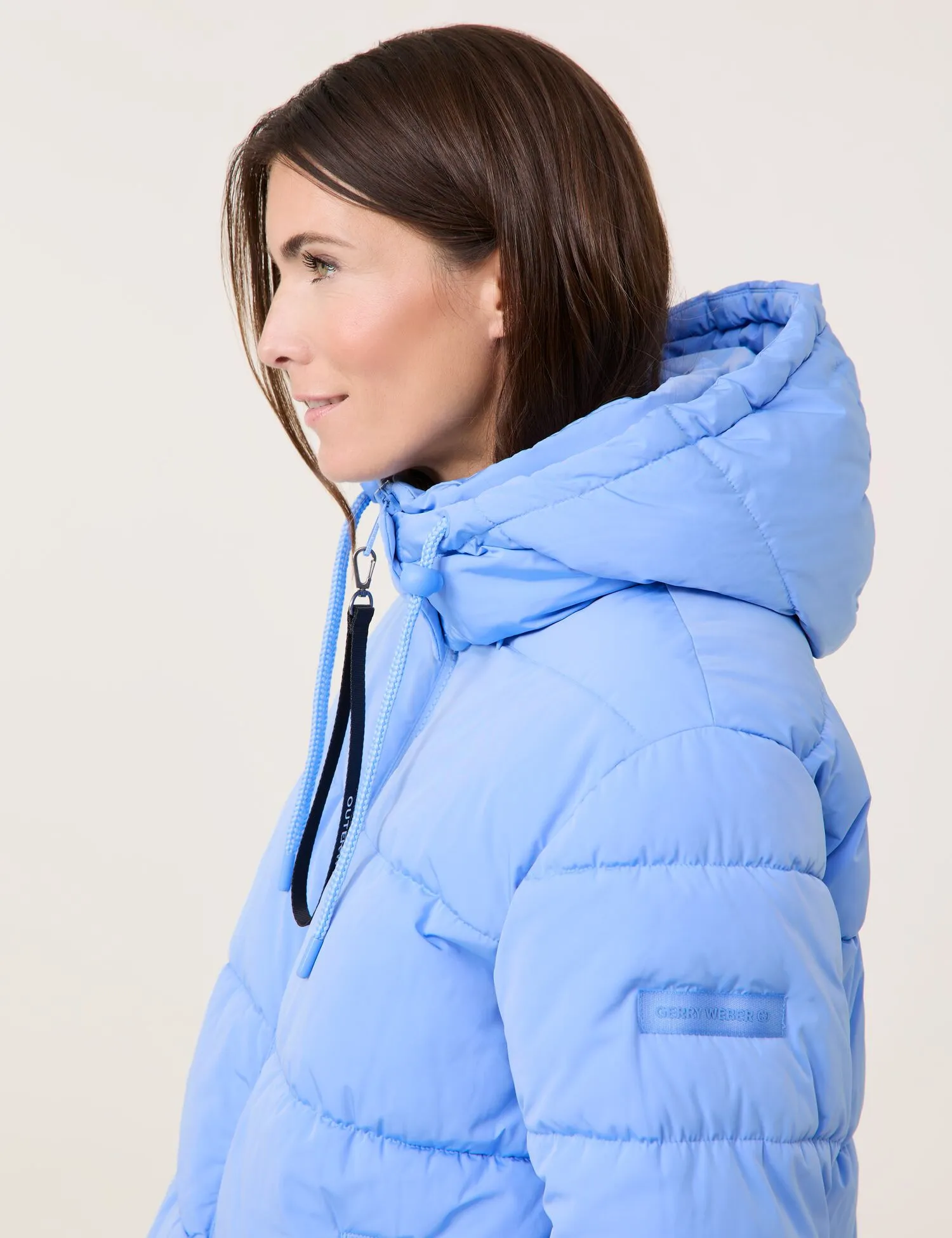 Outdoor jacket with a detachable hood