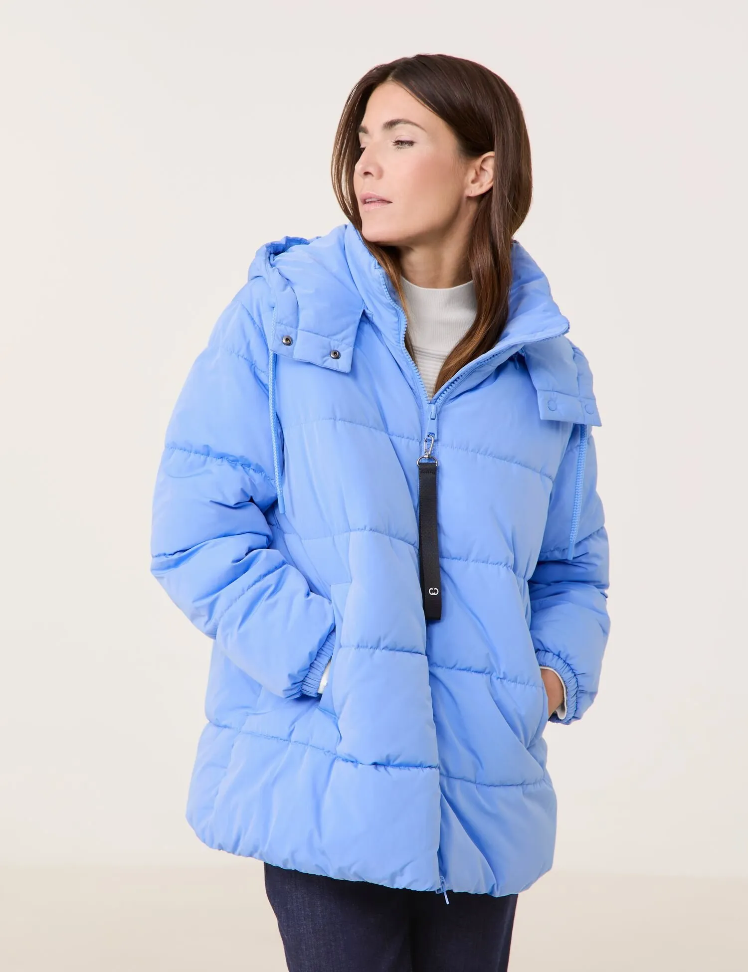 Outdoor jacket with a detachable hood